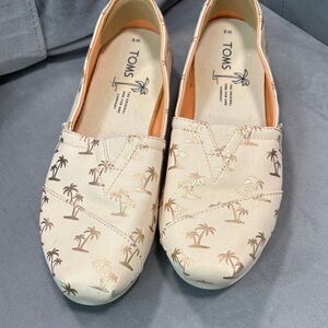 Toms Peach Canvas Slip-Ons with Gold Palm Motif